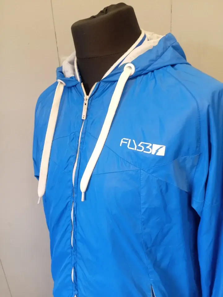 Blue and white Fly53 windbreaker jacket from the 1990s 2.webp