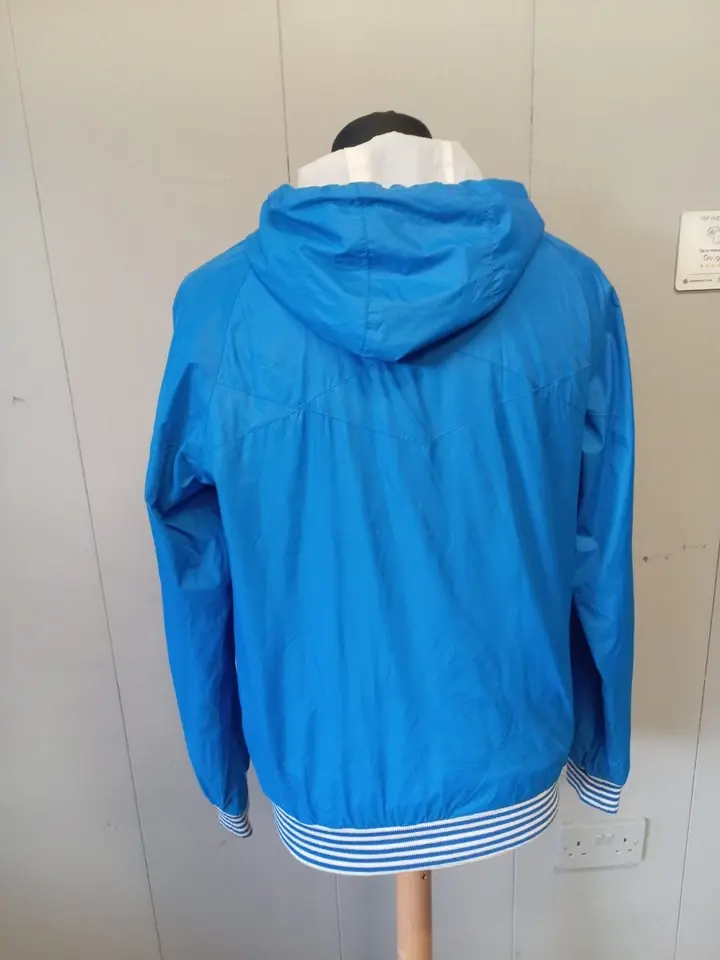 Blue and white Fly53 windbreaker jacket from the 1990s 3.webp